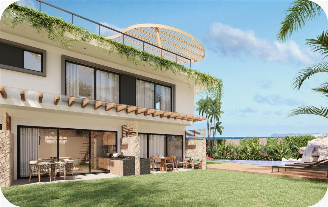 Casa moderna com fachada em pedra e vista para o mar