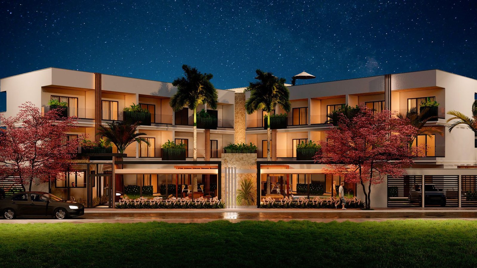 Fachada iluminada de empreendimento residencial do Grupo Bergano à noite